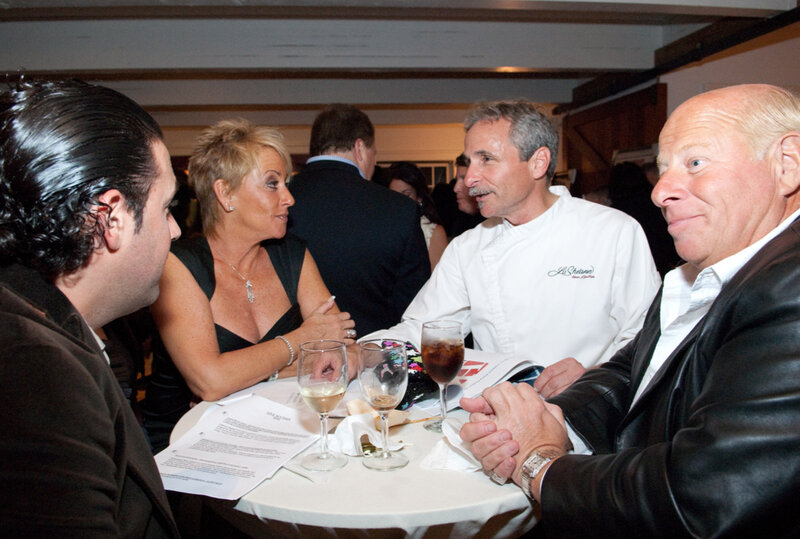 Chef Giorgio speaking with people at Corporate Party