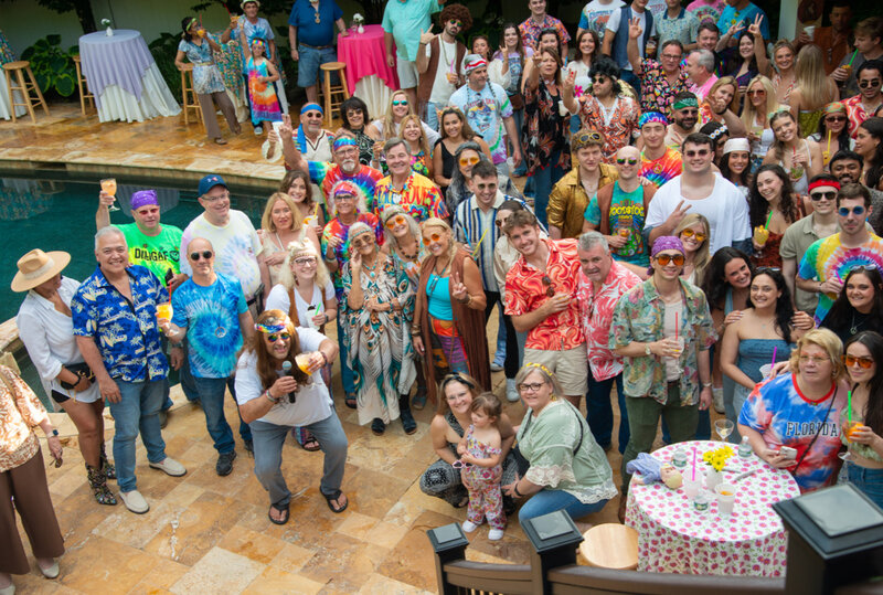 Large group of party guests next to pool