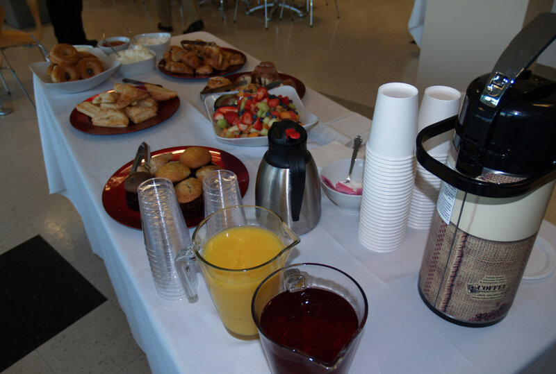 Juice, coffee and pastries on table