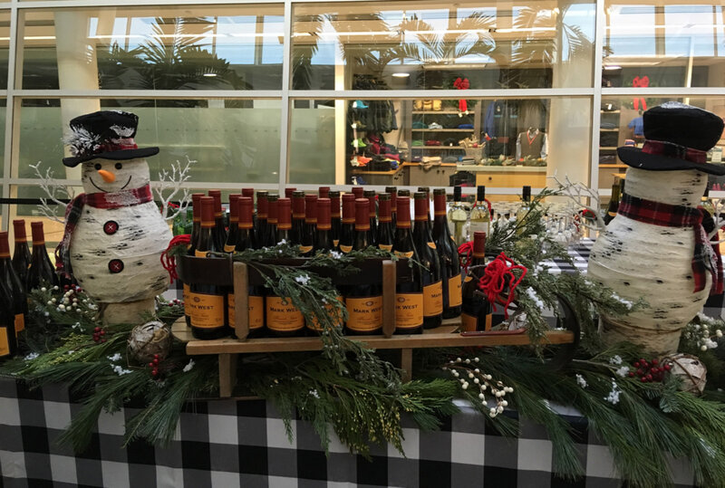 Red wine bottles on table with Snowmen decorations